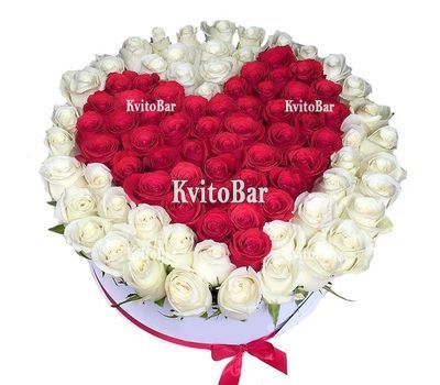 Heart of red roses surrounded by white roses